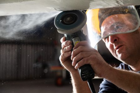 A boat gelcoat repair technician