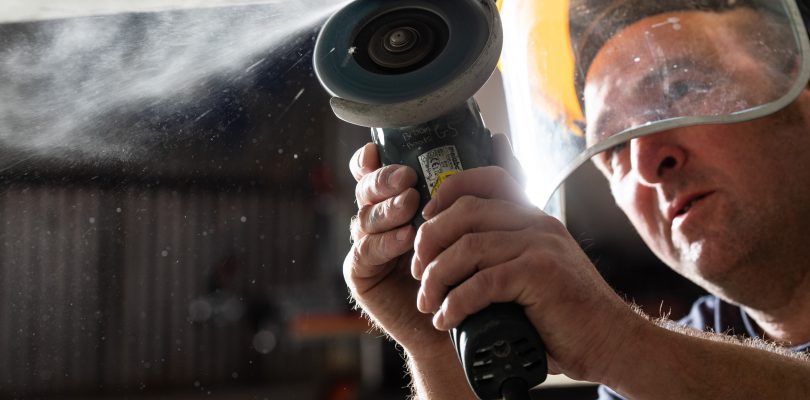 A boat gelcoat repair technician