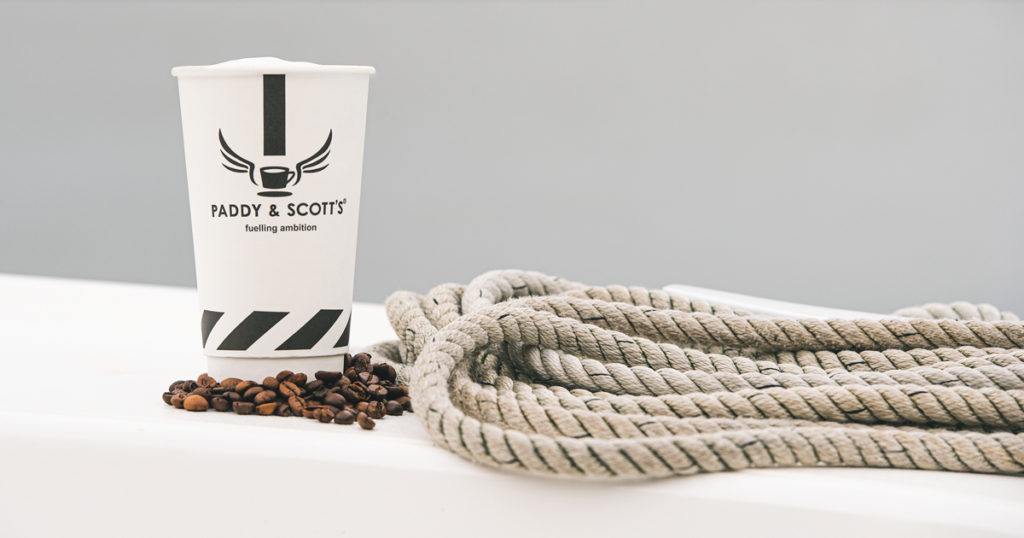 A Paddy and Scott coffee cup on a Broom Boat